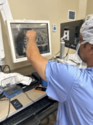 Dr. Anton Thompkins reviewing the diagnostic MR imaging