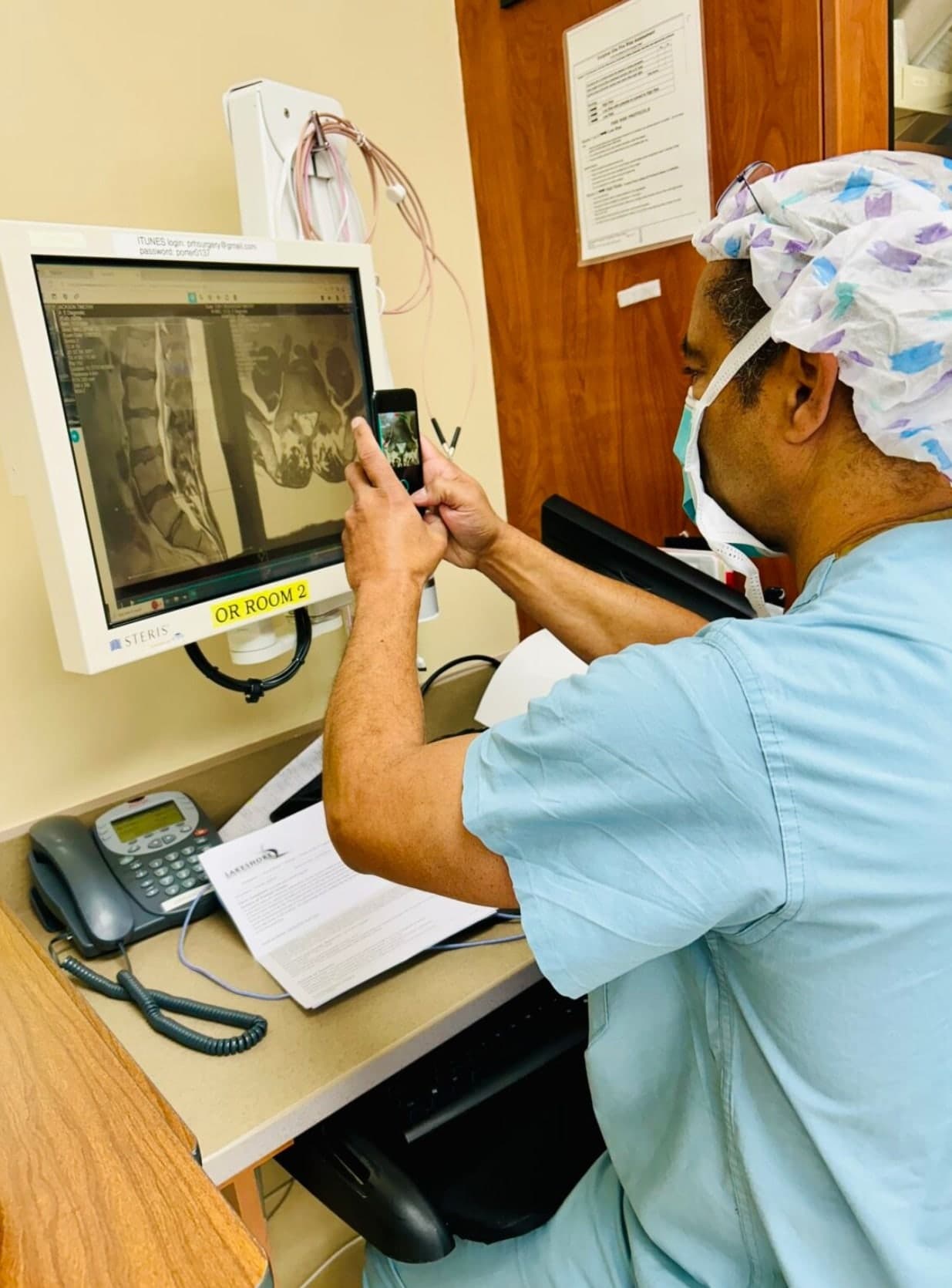 A surgeon reviewing diagnostic imaging with the Bolt Navigation Unit