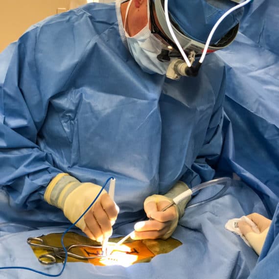 A surgeon operating on a patient