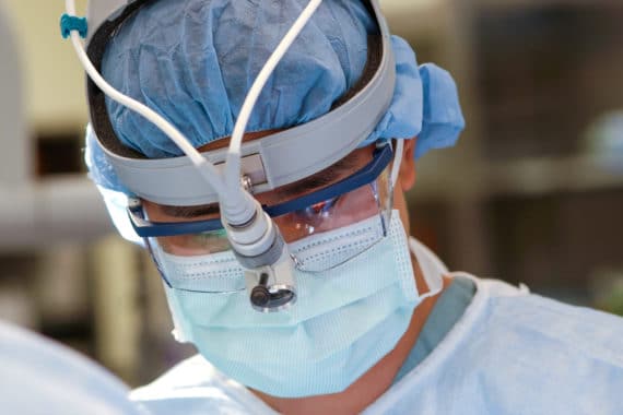 A surgeon during a medical procedure