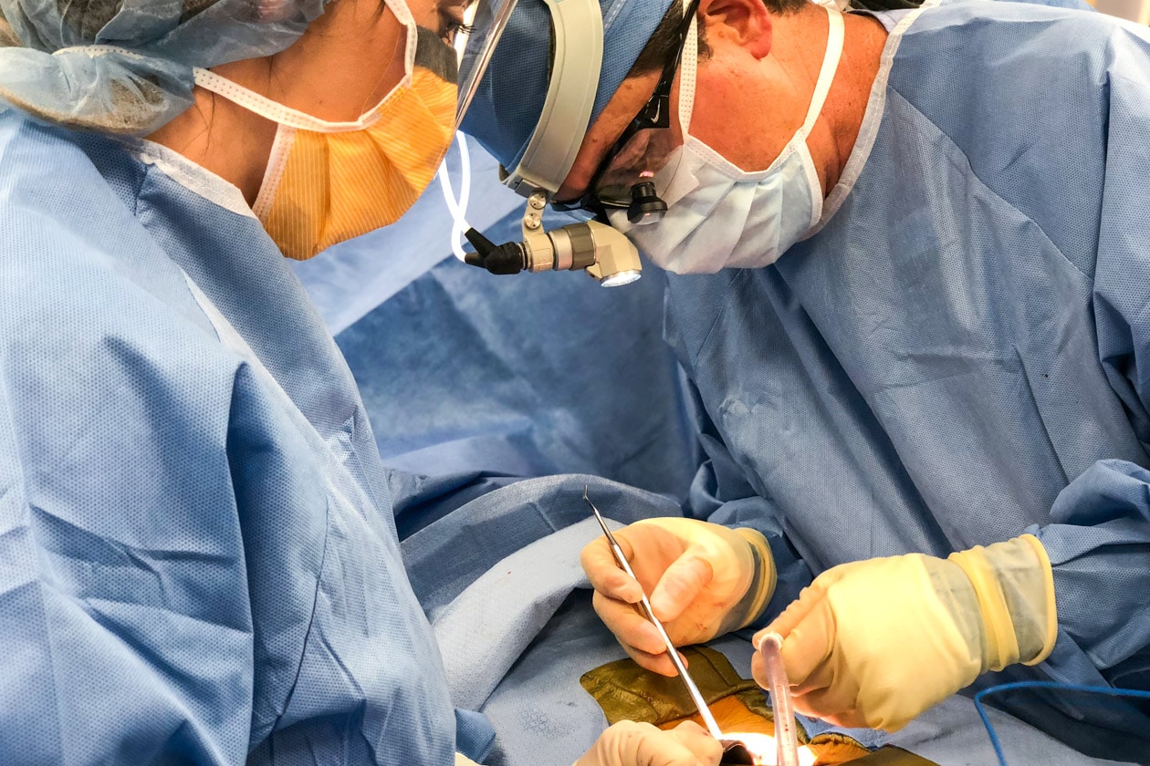 A surgeon operating on a patient